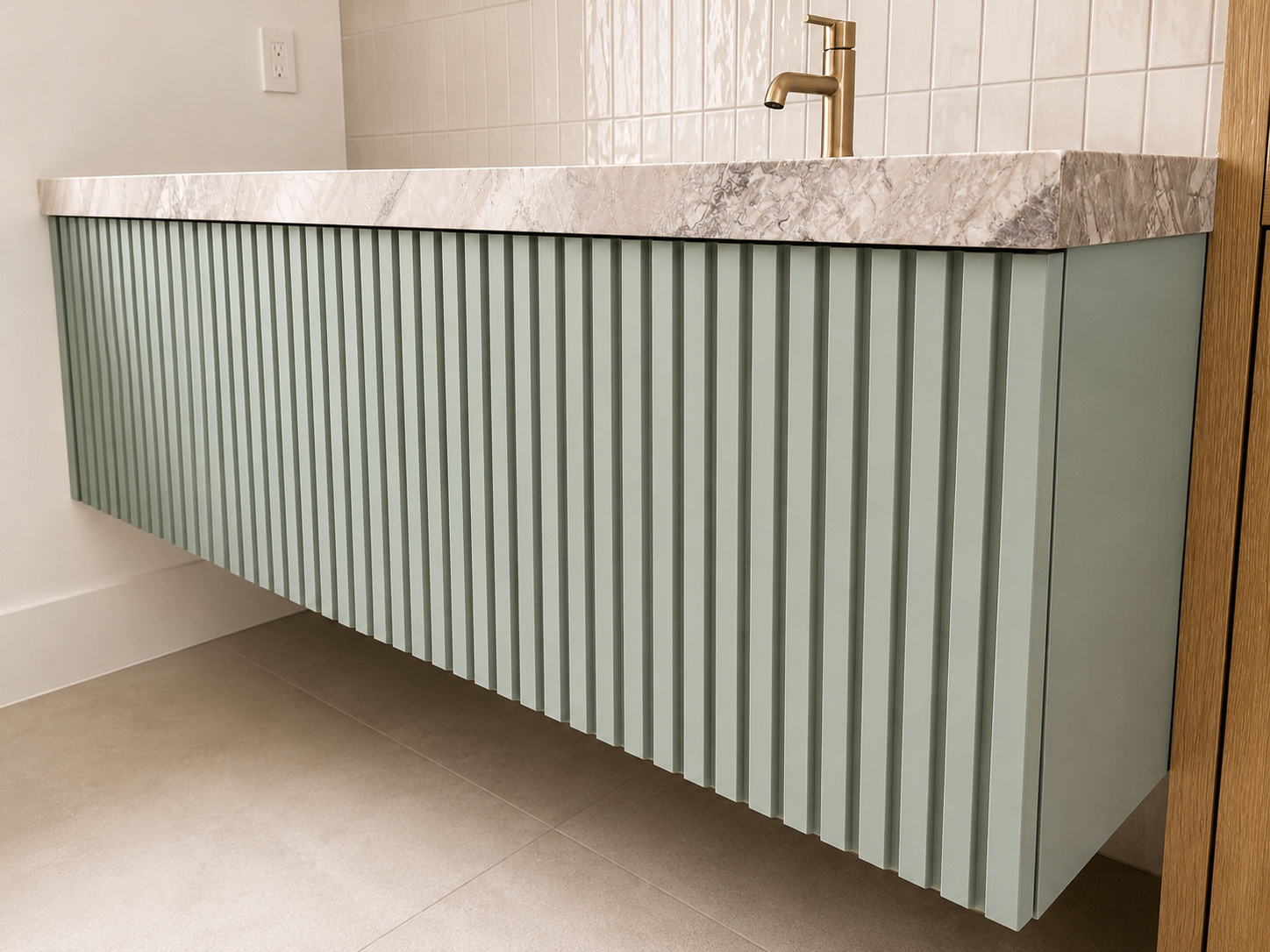 Sage-green fluted vanity with marble top | Sunshine Alliance, Boca Raton FL