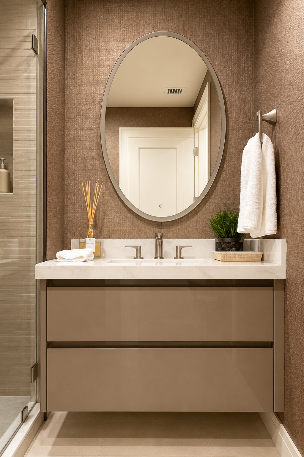 Taupe floating vanity with oval mirror | Sunshine Alliance, South Florida
