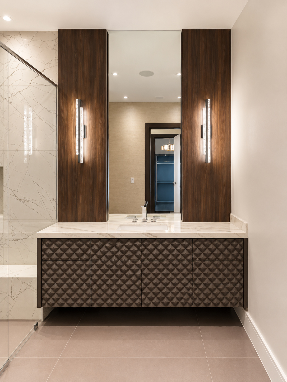 Walnut vanity in a marble bathroom | Sunshine Alliance, Deerfield Beach FL