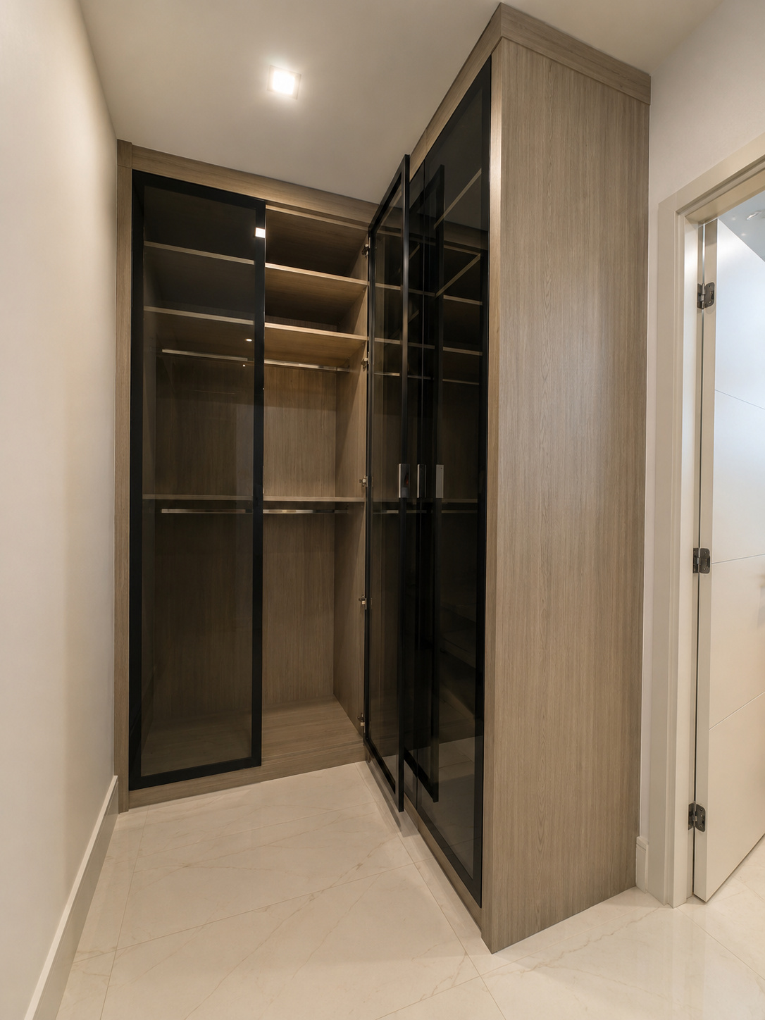 Glass-front walk-in closet with integrated LED | Sunshine Alliance, Deerfield Beach FL